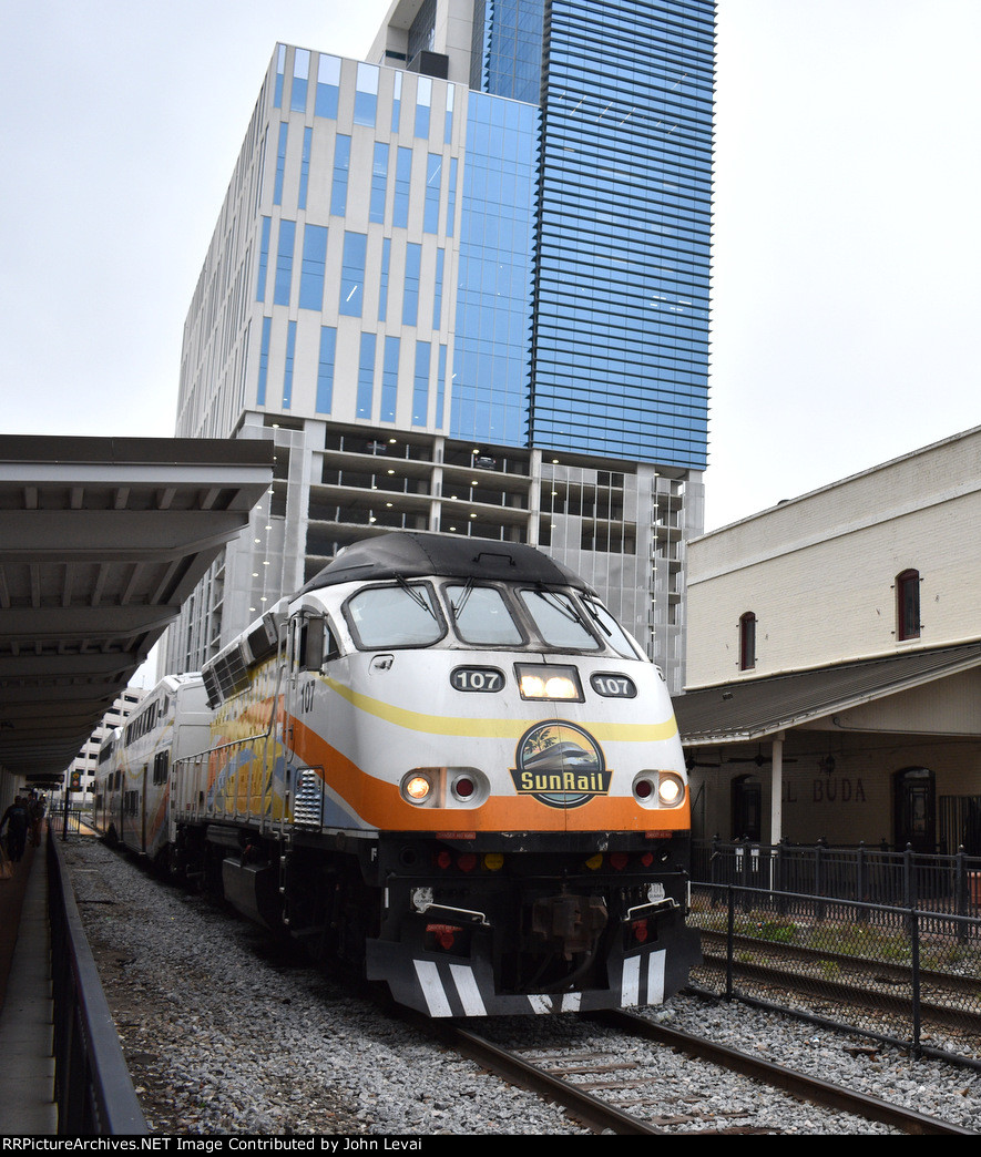 A morning Sunrail train departs Church Street Station heading to DeLand on an overcast morning 